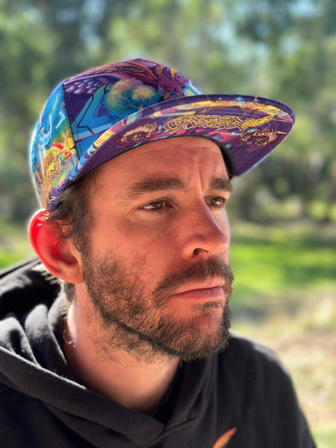 Golden Phoenix Grassroots California cap with embroidered logo, front view showing adjustable strap and vibrant gold and green colors.